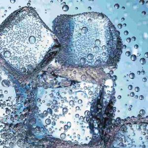 Clearly Canadian Sparkling Mineral Water Bottle 325ml Held in One Hand on a Deck